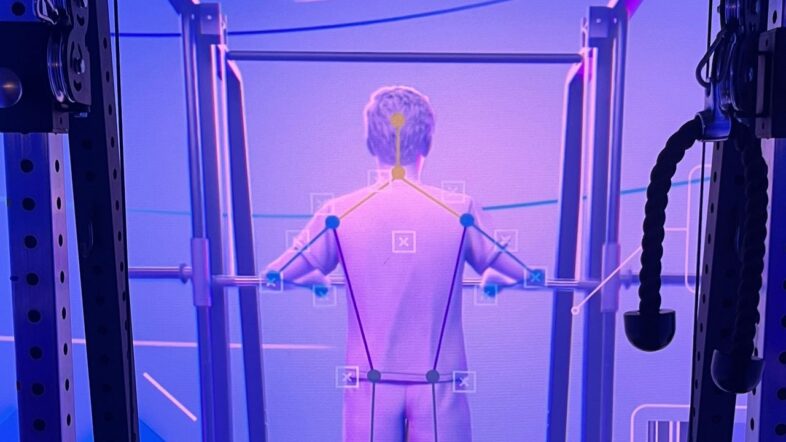 'This just knows so much more than a human ever could': Meet CoachCube, the intelligent AI personal trainer that lives inside a Tron-style box room